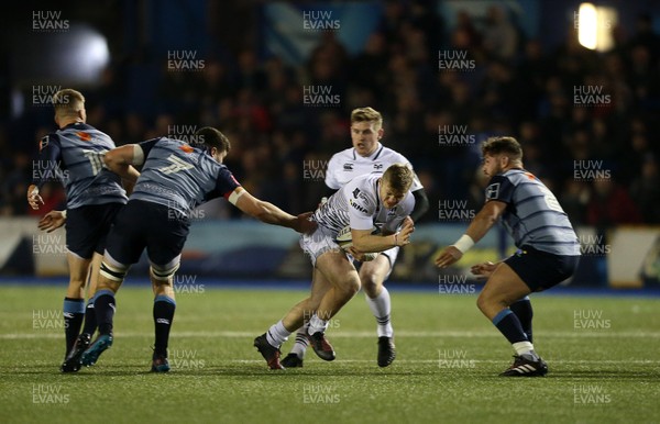 171117 - Cardiff Blues v Ospreys - Anglo Welsh Cup - Kieran Williams of Ospreys is tackled by Sion Bennett and Kirby Myhill of Cardiff Blues