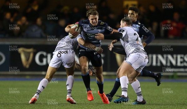 171117 - Cardiff Blues v Ospreys - Anglo Welsh Cup - Max Llewellyn of Cardiff Blues is tackled by James Hook and Rhys Williams of Ospreys