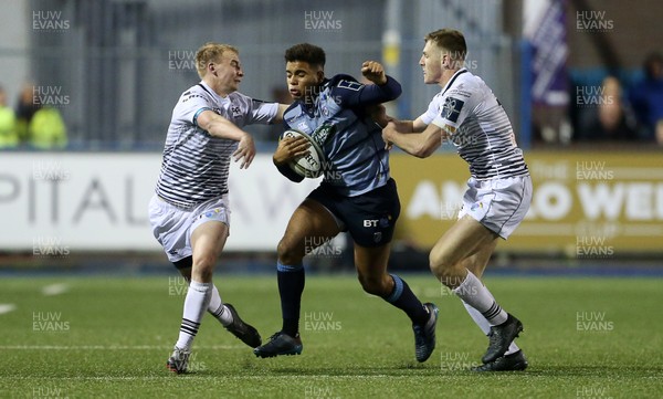 171117 - Cardiff Blues v Ospreys - Anglo Welsh Cup - Ben Thomas of Cardiff Blues is tackled by Luke Price and Tom Williams of Ospreys