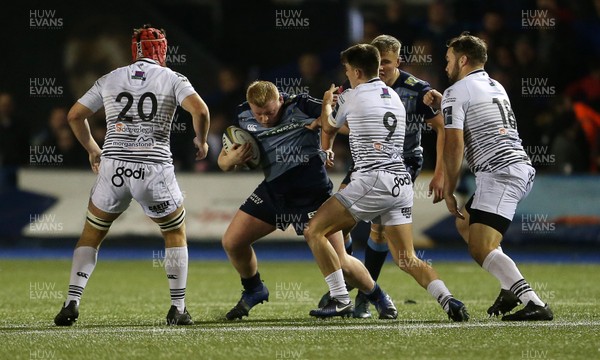 171117 - Cardiff Blues v Ospreys - Anglo Welsh Cup - Keiron Assiratti of Cardiff Blues is tackled by Reuben Morgan-Williams of Ospreys