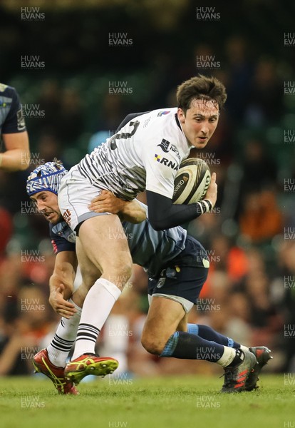 280418 - Cardiff Blues v Ospreys, Judgement DAY VI, Guinness PRO14 - Sam Davies of Ospreys is tackled by Matthew Morgan of Cardiff Blues