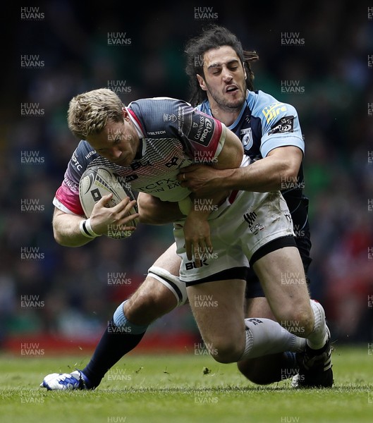 300416 - Cardiff Blues v Ospreys - Judgement Day - Guinness PRO12 - Jonathan Spratt of Ospreys is tackled by Josh Navidi of Cardiff Blues