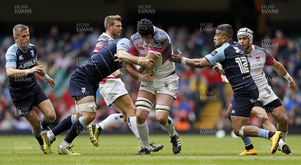 300416 - Cardiff Blues v Ospreys - Judgement Day - Guinness PRO12 - Adam Beard of Ospreys is tackled by James Down and Rey Lee-Lo of Cardiff Blues