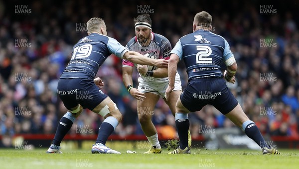 300416 - Cardiff Blues v Ospreys - Judgement Day - Guinness PRO12 - Scott Baldwin of Ospreys is tackled by Jarrad Hoeata and Matthew Rees of Cardiff Blues