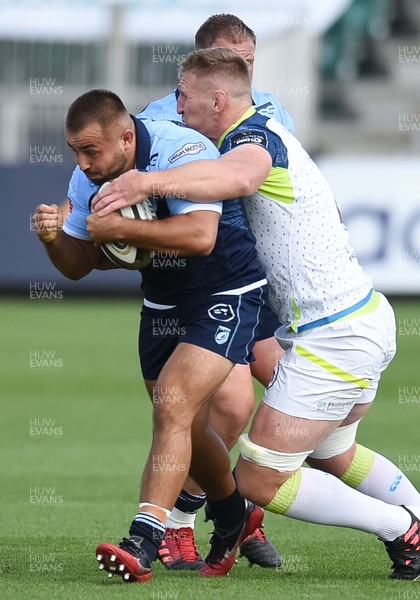 300820 - Cardiff Blues v Ospreys - Guinness Pro 14 - Liam Belcher of Cardiff Blues is tackled by Bradley Davies of Ospreys 