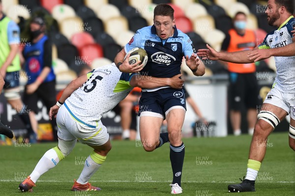 300820 - Cardiff Blues v Ospreys - Guinness Pro 14 - Josh Adams of Cardiff Blues  is tackled by Dan Evans of Ospreys 