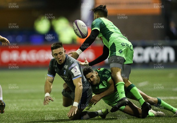071219 - Cardiff Blues v Pau, European Challenge Cup - Josh Adams of Cardiff Blues looks to offload as he takes on Charly Malie of Pau