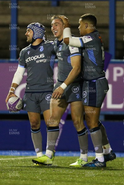 071219 - Cardiff Blues v Pau, European Challenge Cup - Josh Adams of Cardiff Blues is congratulated by Matthew Morgan of Cardiff Blues and Ben Thomas of Cardiff Blues after scoring his second try