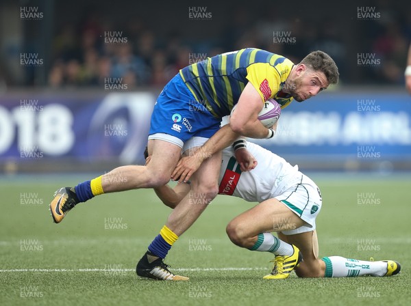 210418 - Cardiff Blues v Pau, European Challenge Cup Semi-Final - Alex Cuthbert of Cardiff Blues tis tackled by Tom Taylor of Pau
