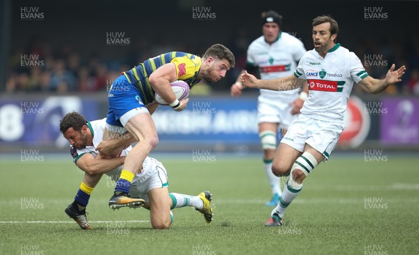 210418 - Cardiff Blues v Pau, European Challenge Cup Semi-Final - Alex Cuthbert of Cardiff Blues tis tackled by Tom Taylor of Pau