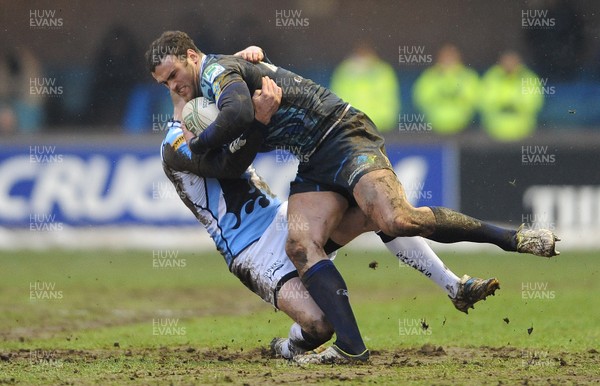 190113 - Cardiff Blues v Sale Sharks - Heineken Cup -Jamie Roberts of Cardiff Blues is tackled by Jordan Davies of Sale