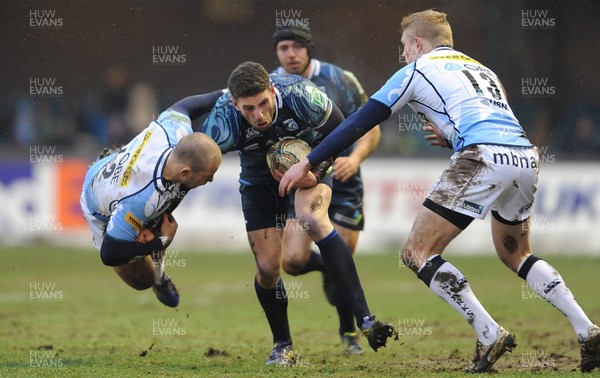 190113 - Cardiff Blues v Sale Sharks - Heineken Cup -Alex Cuthbert of Cardiff Blues is tackled by Mark Jennings of Sale