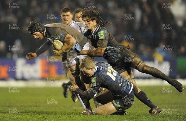 190113 - Cardiff Blues v Sale Sharks - Heineken Cup -Kearnan Myall of Sale is tackled by Josh Navidi and Owen Williams of Cardiff Blues