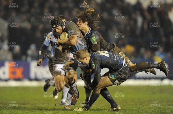 190113 - Cardiff Blues v Sale Sharks - Heineken Cup -Kearnan Myall of Sale is tackled by Josh Navidi and Owen Williams of Cardiff Blues