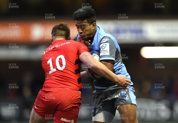 151218 - Cardiff Blues v Saracens - European Rugby Champions Cup - Rey Lee-Lo of Cardiff Blues is tackled by Owen Farrell of Saracens