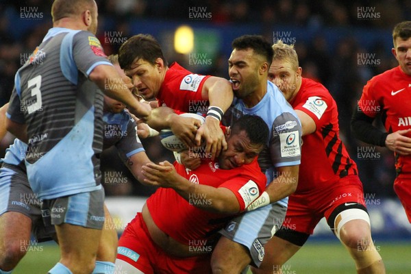 151218 - Cardiff Blues v Saracens - European Rugby Champions Cup - Mako Vunipola of Saracens is tackled by Willis Halaholo of Cardiff Blues