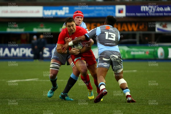 151218 - Cardiff Blues v Saracens - European Rugby Champions Cup - Brad Barrett of Saracens is tackled by Seb Davies and Rey Le Lo of Cardiff Blues