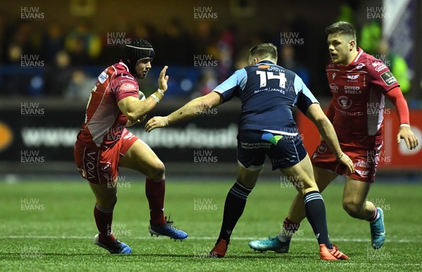 030120 - Cardiff Blues v Scarlets - Guinness PRO14 - Leigh Halfpenny of Scarlets is tackled by Owen Lane of Cardiff Blues
