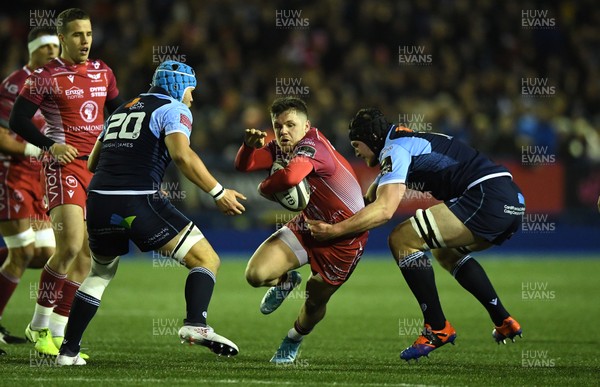 030120 - Cardiff Blues v Scarlets - Guinness PRO14 - Steff Evans of Scarlets is tackled by James Ratti of Cardiff Blues