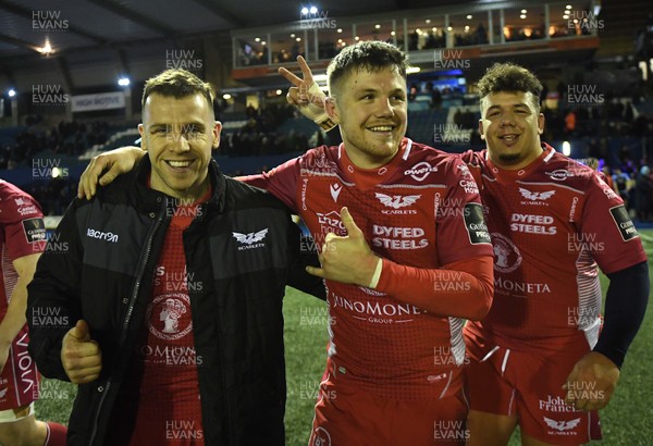 030120 - Cardiff Blues v Scarlets - Guinness PRO14 - Gareth Davies, Steff Evans and Javan Sebastian of Scarlets at the end of the game