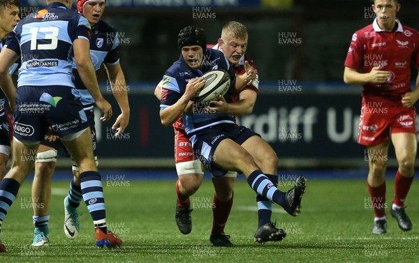 041019 - Cardiff Blues A v Scarlets A - Celtic Cup - Ioan Davies of Cardiff Blues is tackled by Jac Morgan of Scarlets