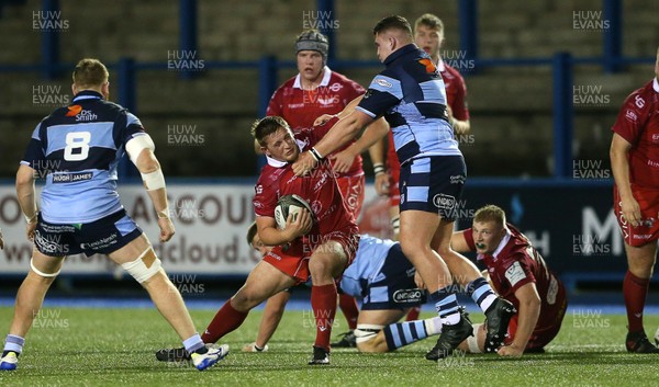 041019 - Cardiff Blues A v Scarlets A - Celtic Cup - Dafydd Hughes of Scarlets is tackled by Ben Warren of Cardiff Blues