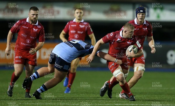 041019 - Cardiff Blues A v Scarlets A - Celtic Cup - Jac Morgan of Scarlets is tackled by Ben Warren of Cardiff Blues