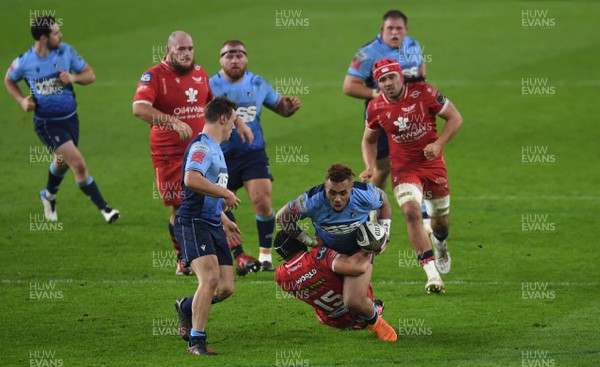 090121 - Cardiff Blues v Scarlets - Guinness PRO14 - Willis Halaholo of Cardiff Blues is tackled by Leigh Halfpenny of Scarlets