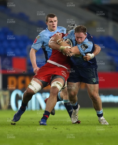 090121 - Cardiff Blues v Scarlets, Guinness PRO14 - Corey Domachowski of Cardiff Blues takes on Sione Kalamafoni of Scarlets
