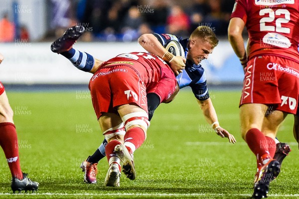 220319 - Cardiff Blues v Scarlets, Guinness PRO14 - Gareth Anscombe of Cardiff Blues is tackled