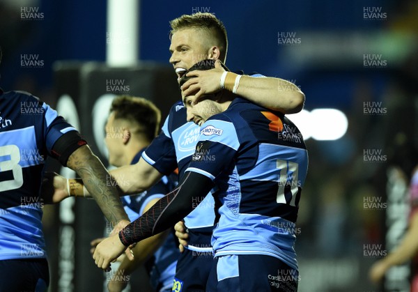 220319 - Cardiff Blues v Scarlets - Guinness PRO14 - Aled Summerhill of Cardiff Blues celebrates his second try with Gareth Anscombe (left)