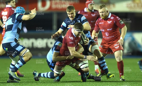 220319 - Cardiff Blues v Scarlets - Guinness PRO14 - Steve Cummins of Scarlets is tackled by Rory Thornton of Cardiff Blues