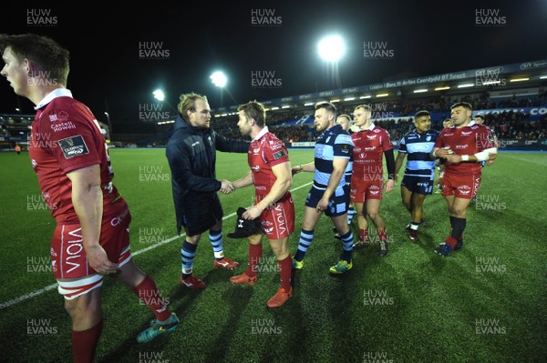 220319 - Cardiff Blues v Scarlets - Guinness PRO14 - Leigh Halfpenny of Scarlets and Kristian Dacey of Cardiff Blues at the end of the game
