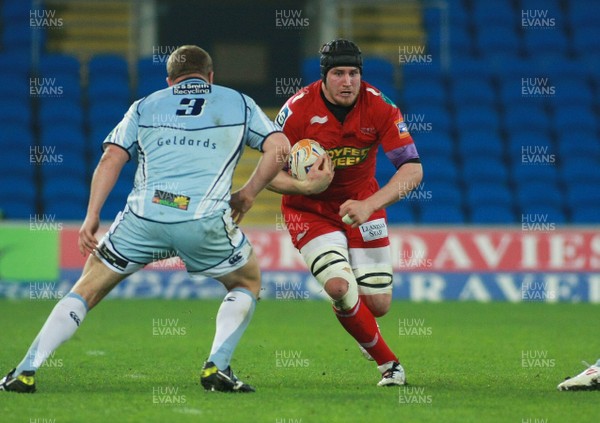 240312 Cardiff Blues v Scarlets - RaboDirect PRO 12 -Scarlets' Ben Morgan takes on Blues' Scott Andrews