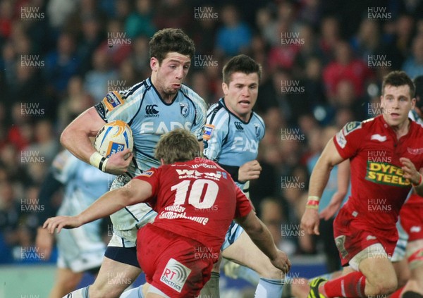 240312 Cardiff Blues v Scarlets - RaboDirect PRO 12 -Blues' Alex Cuthbert takes on Scarlets' Aled Thomas 