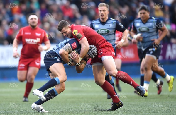 311217 - Cardiff Blues v Scarlets - Guinness PRO14 - Tom James of Cardiff Blues is tackled by Scott Williams of Scarlets