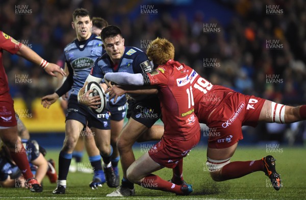 311217 - Cardiff Blues v Scarlets - Guinness PRO14 - Ellis Jenkins of Cardiff Blues is tackled by Rhys Patchell and David Bulbring of Scarlets