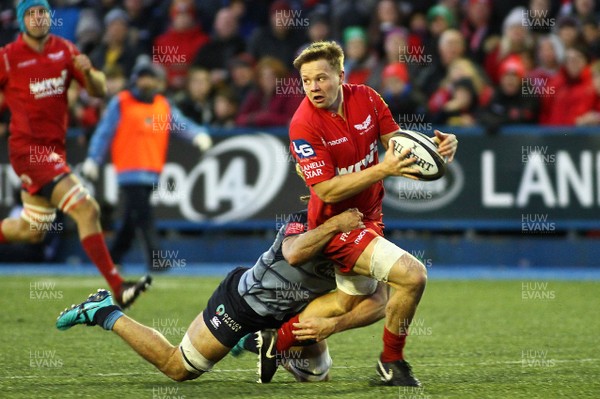 311217 - Cardiff Blues v Scarlets - GuinnessPro14 - James Davies of Scarlets is tackled by Josh Navidi of Cardiff Blues