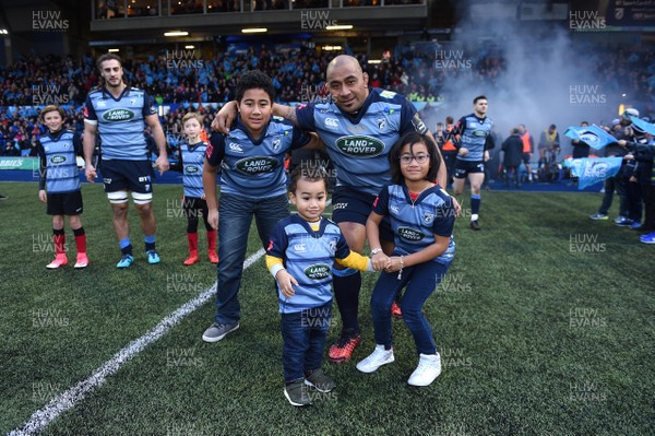 311217 - Cardiff Blues v Scarlets - Guinness PRO14 - Taufa'ao Filise of Cardiff Blues leads out his side on his 250th game with his family