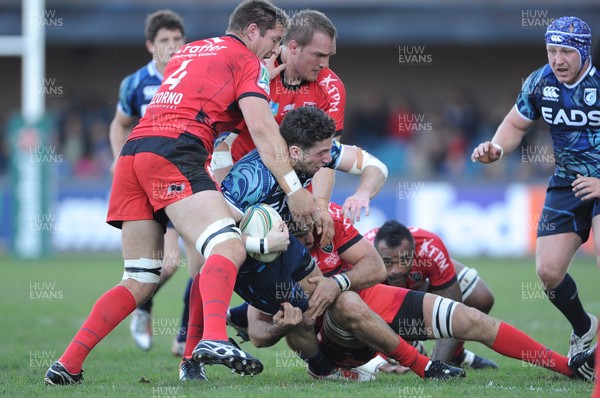 211012 - Cardiff Blues v Toulon - Heineken Cup -Alex Cuthbert of Cardiff Blues is tackled by Gethin Jenkins and Juan Martin Fernandez Lobbe of Toulon