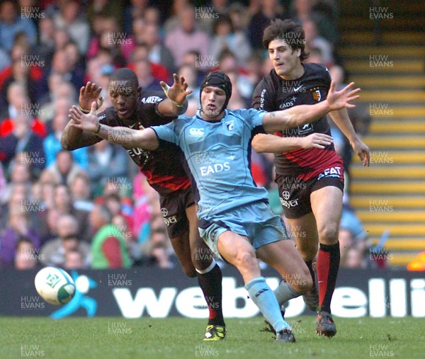 11.04.09 - Heineken Cup Rugby Quarter Final -  Cardiff Blues v Toulouse Yannick Nyanga and David Skrela of Toulouse try to beat Cardiff Blues' Tom James to the ball 