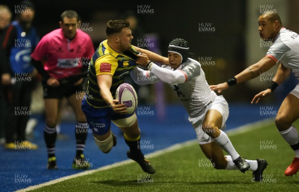 140118 - Cardiff Blues v Stade Toulousain, European Rugby Challenge Cup - Owen Lane of Cardiff Blues releases the ball as he is tackled by Cheslin Kolbe of Toulouse