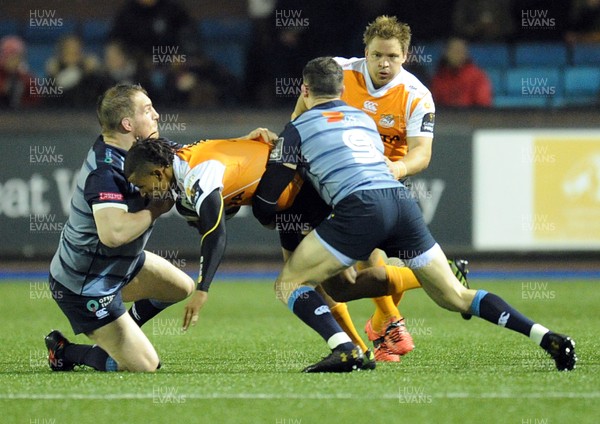100218 - Cardiff Blues v Toyota Cheetahs - Guinness PRO14 - Clayton Blommetjies of Toyota Cheetahs is tackled by Gethin Jenkins of Cardiff Blues and Lloyd Williams of Cardiff Blues