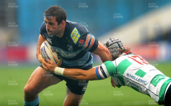 021113 - Cardiff Blues v Benetton Treviso - RaboDirect PRO12 -Dafydd Hewitt of Cardiff Blues is tackled by Alberto Sgarbi of Benetton Treviso