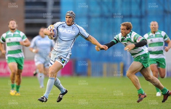 220912 - Cardiff Blues v Treviso - RaboDirect PRO12 -Tom James of Cardiff Blues gets past Giulio Toniolatti of Benetton Treviso