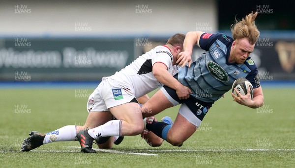 240318 - Cardiff Blues v Ulster  - Guinness PRO14 - Kristian Dacey of Cardiff Blues is tackled by Andrew Warwick of Ulster