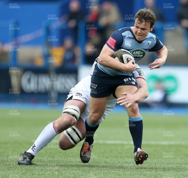 240318 - Cardiff Blues v Ulster  - Guinness PRO14 - Jarrod Evans of Cardiff Blues is tackled by Iain Henderson of Ulster