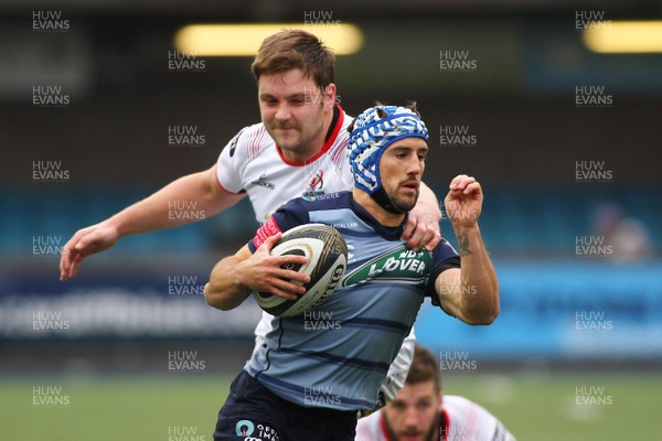 240318 - Cardiff Blues v Ulster - Guinness PRO14 - Matthew Morgan of Cardiff Blues is tackled by Iain Henderson of Ulster