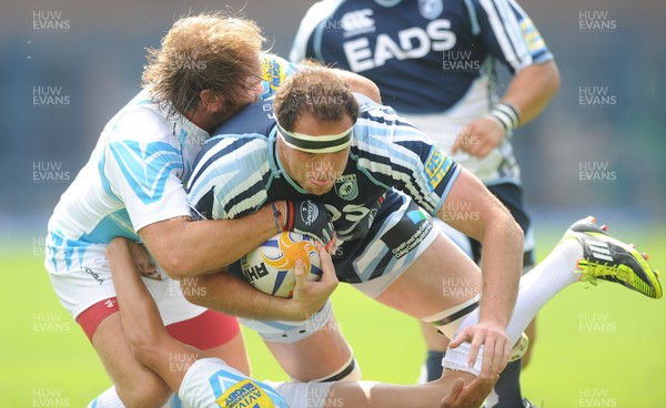 110812 - Cardiff Blues v Worcester Warriors - Preseason Friendly -Lou Reed of Cardiff Blues is tackled by Andy Goode of Worcester