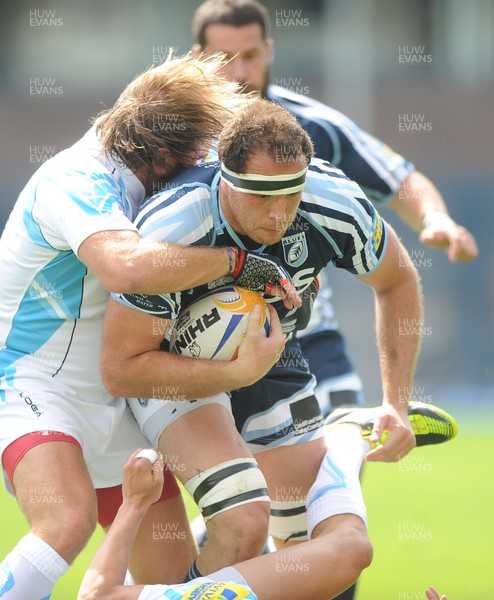 110812 - Cardiff Blues v Worcester Warriors - Preseason Friendly -Lou Reed of Cardiff Blues is tackled by Andy Goode of Worcester